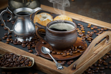 Coffee in a cup and saucer on an old background.
