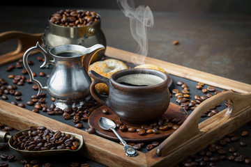 Black coffee on an old background in a cup