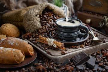 Fototapeta na wymiar Black coffee on an old background in a cup
