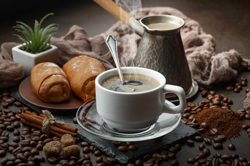 Black coffee on an old background in a cup