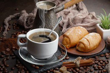 Black coffee on an old background in a cup