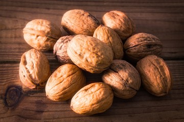group of nuts on wood