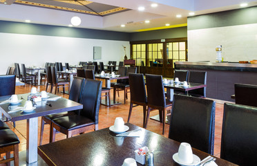Oriental style interior of the japanese restaurant with nicely served table with napkins of the luxury five stars resort, hotel. Interior design.