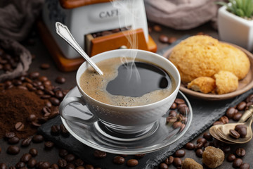 Black coffee on an old background in a cup