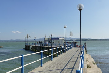 pier for ferries to Maggiore Island and Polvese Island in the lakeside of Castiglione del Lago on...