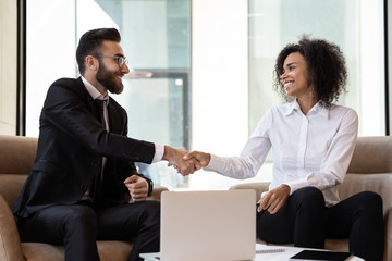 Multiracial business partners handshake get acquainted at meeting