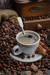 Coffee in a cup and saucer on an old background.