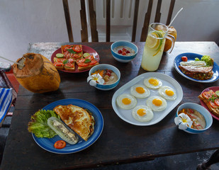 Diet menu. Healthy lifestyle on wooden old table . coconut, eggs, oatmeal, sandwich, vegetables, salad served with simple plates