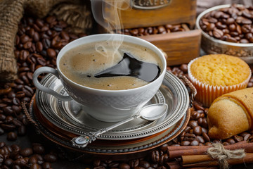 Black coffee on an old background in a cup
