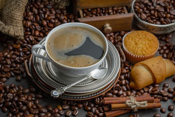 Black coffee on an old background in a cup