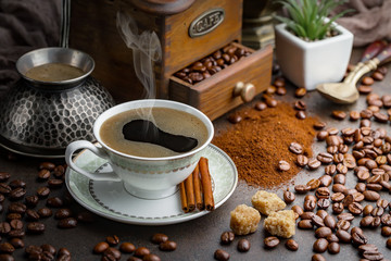 Black coffee on an old background in a cup
