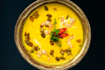 Pumpkin soup on a black background