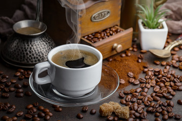 Black coffee on an old background in a cup