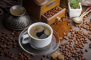 Black coffee on an old background in a cup