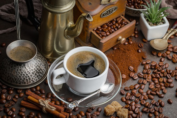 Black coffee on an old background in a cup