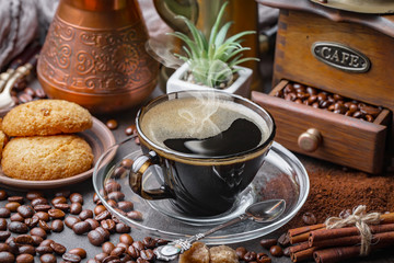 Coffee in a cup and saucer on an old background.