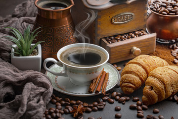 Black coffee on an old background in a cup