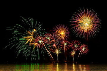 Fototapeta na wymiar Colorful fireworks celebration and the midnight sky background.
