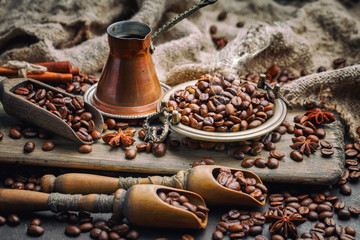 Coffee in a cup on a background of coffee beans, on an old background.
