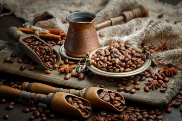 Coffee in a cup on a background of coffee beans, on an old background.