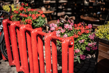 Old red battery decoration flowers in old city