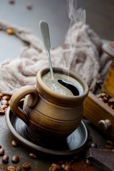 Black coffee on an old background in a cup