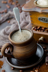 Coffee in a cup and saucer on an old background.