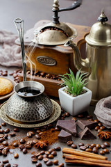 Coffee in a cup and saucer on an old background.