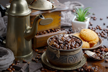 Coffee grains on a table with accessories for coffee