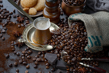 Coffee in a cup and saucer on an old background.
