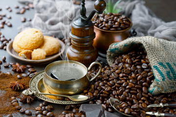 Coffee in a cup and saucer on an old background.
