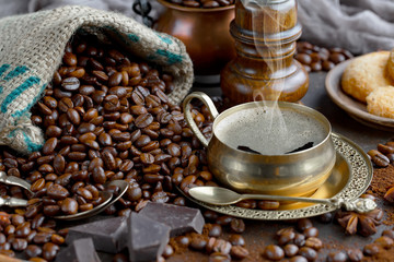 Black coffee on an old background in a cup