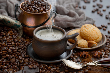 Coffee in a cup and saucer on an old background.