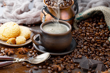 Black coffee on an old background in a cup