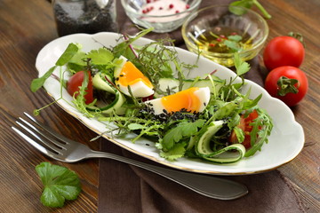 Cucumber, tomato, egg, fresh green salad with black sesame