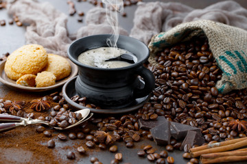 Coffee in a cup and saucer on an old background.