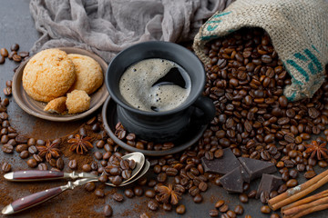 Coffee in a cup and saucer on an old background.