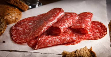 thin slices of raw smoked sausage cervelat on the table
