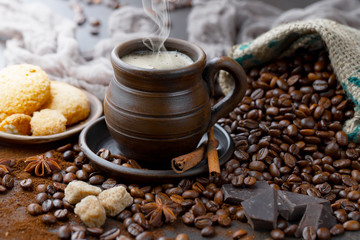 Coffee in a cup and saucer on an old background.