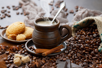 Coffee in a cup and saucer on an old background.