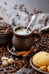 Coffee in a cup and saucer on an old background.