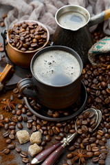 Black coffee on an old background in a cup