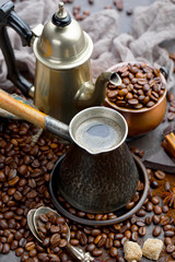 Coffee in a cup and saucer on an old background.