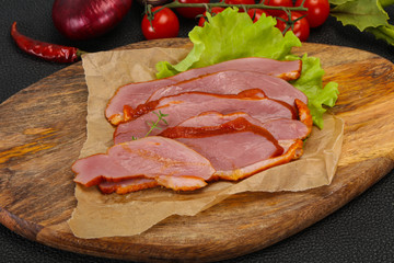 Sliced smoked duck breast served salad