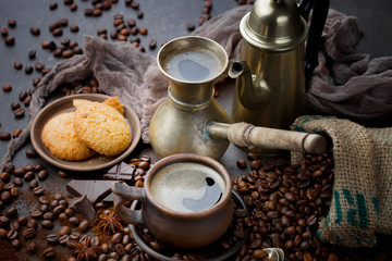 Coffee in a cup and saucer on an old background.