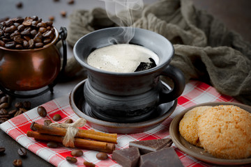 Black coffee on an old background in a cup