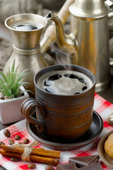 Coffee in a cup and saucer on an old background.