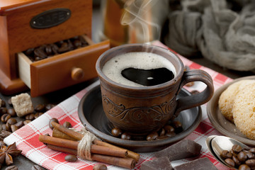 Black coffee on an old background in a cup