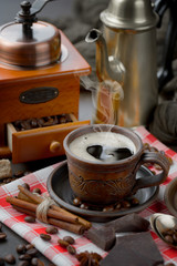 Black coffee on an old background in a cup
