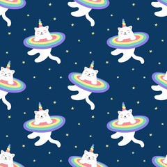 Fototapeta premium Seamless pattern magical kitty unicorn, rainbow, starry sky. A cute white cat flies in space. Vector illustration for children. Print for wrapping, fabric, textile, wallpaper.